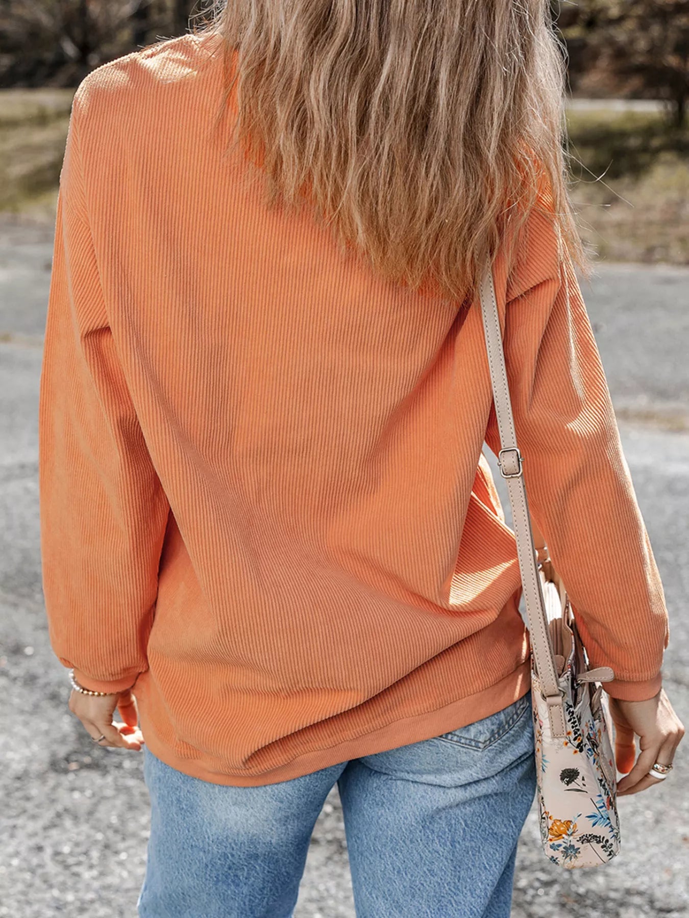 Woman wearing Halloween Ghost Sweatshirt with sequin ghost design