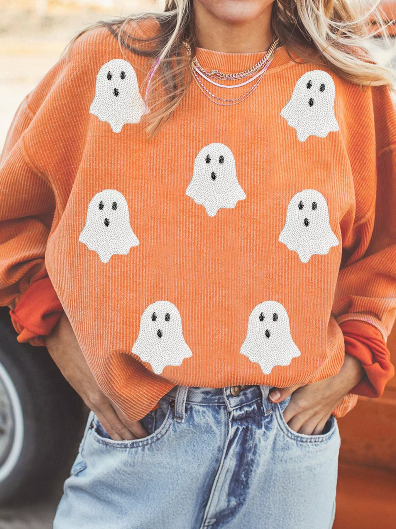 Woman wearing Halloween Ghost Sweatshirt with sequin ghost design