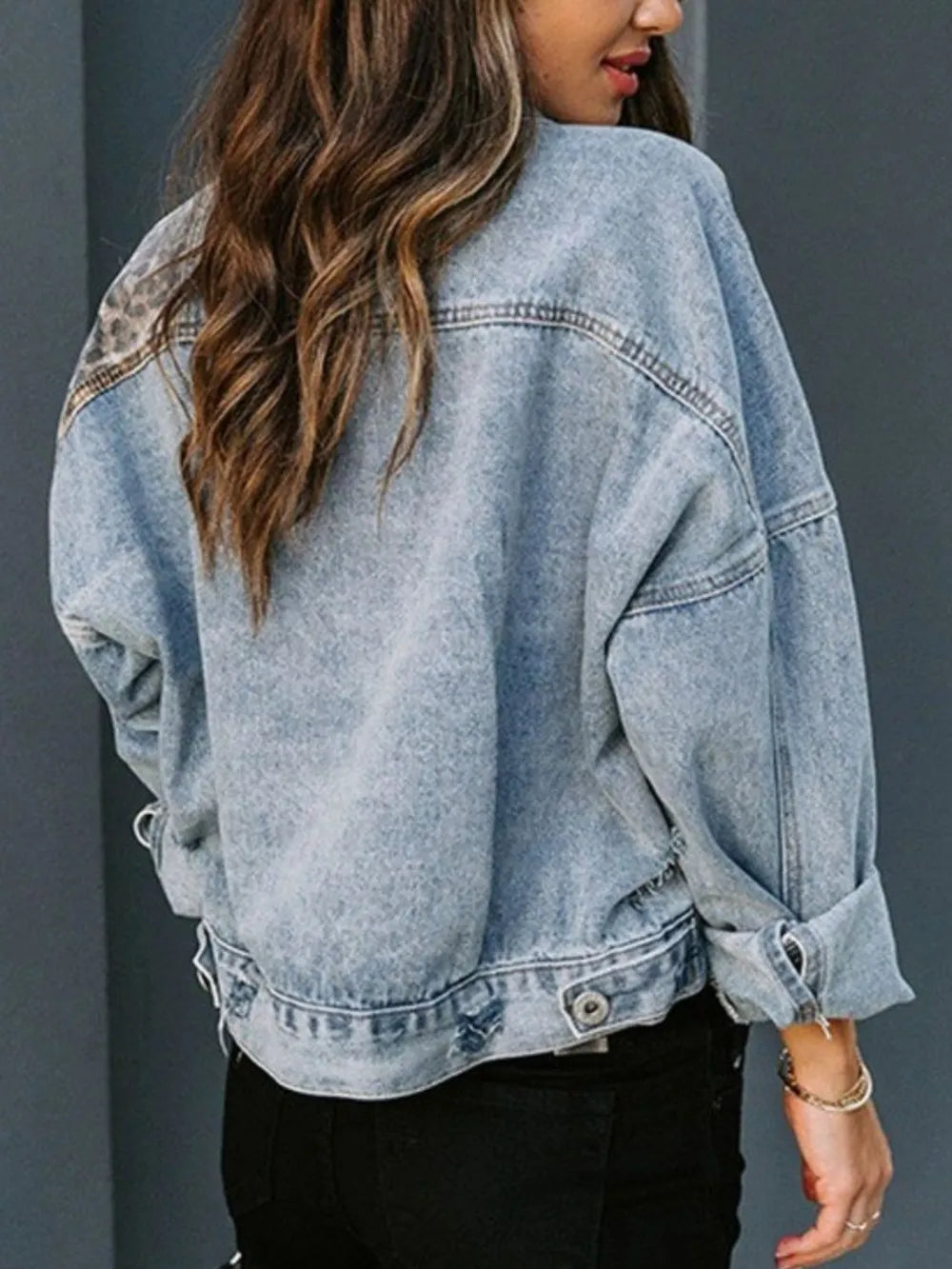 Back look of distressed leopard denim jacket with print