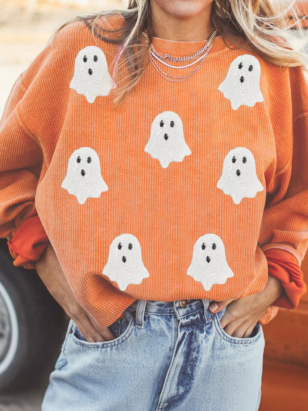 Woman wearing Halloween Ghost Sweatshirt with sequin ghost design